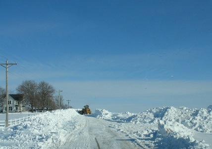 A loader removing snow from a road