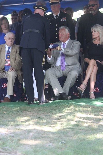 Photo of flag presentation to family of Ralph Bennett