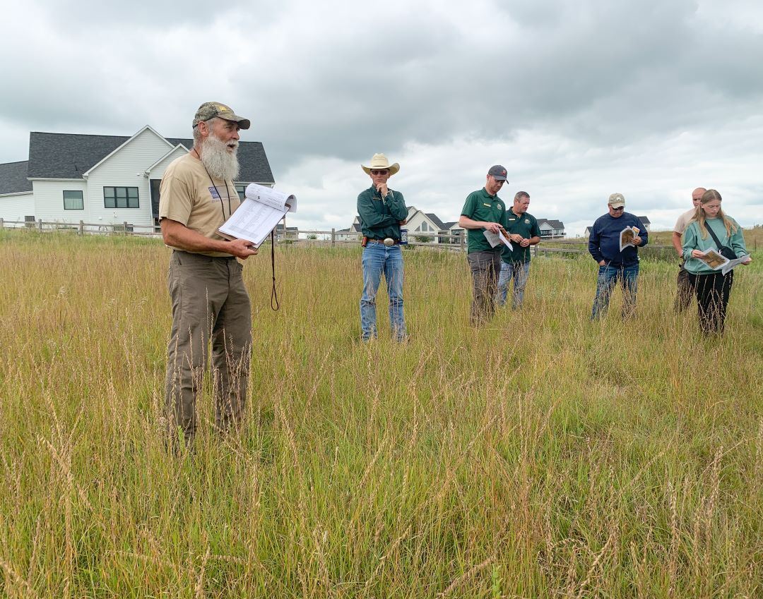 Dr. Tom Rosburg leads small tour of Prairie Valley Preserve